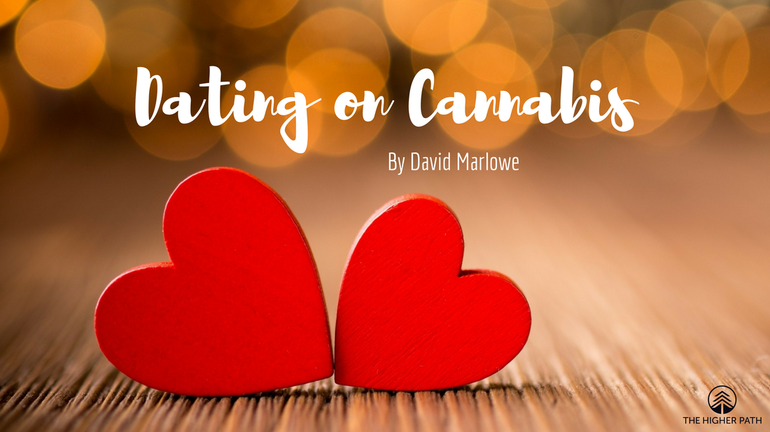 Two red wooden hearts on a wooden surface with the text Dating on Cannabis by David Marlowe against a warm, blurred background.