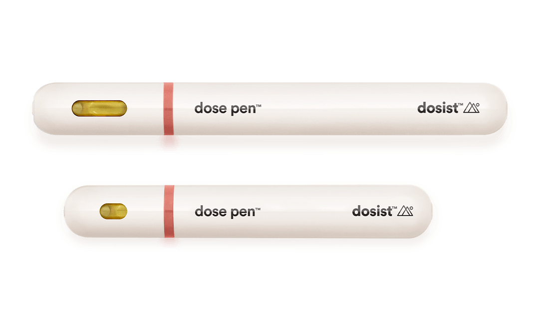 Two white Dosist dose pens displayed horizontally on a black background, featuring minimalist branding and a small viewing window.