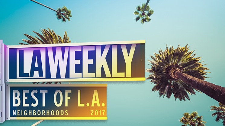LA Weekly Best of L.A. Neighborhoods 2017 sign against a blue sky with palm trees.